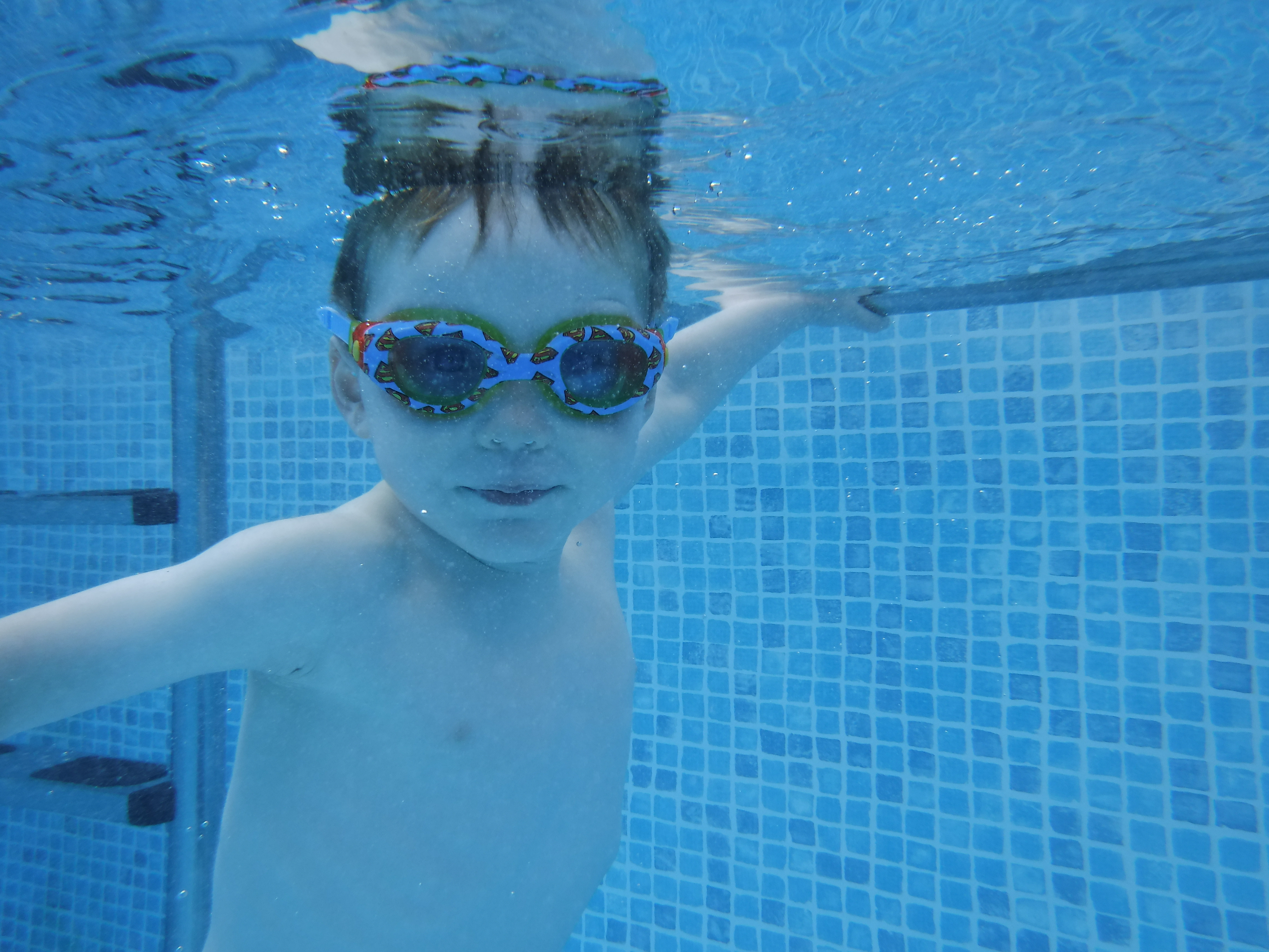 Young swimmer learning in our swim school